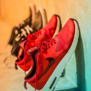 Vibrant red sneakers on display, showcasing modern footwear style.